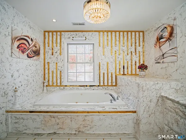 a bathroom with a toilet and a shower curtain