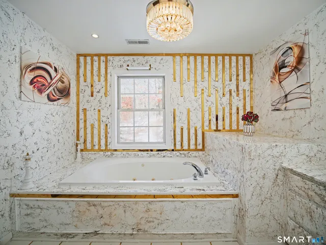 a bathroom with a toilet and a shower curtain