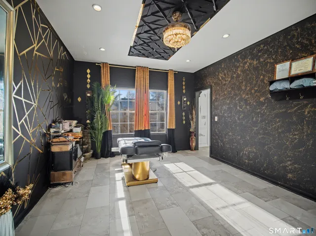 a view of a house with backyard and deck