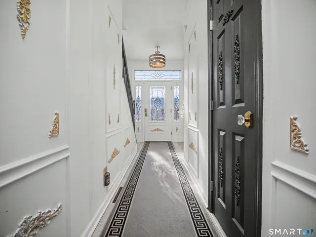 a backyard of a house with barbeque oven and outdoor seating