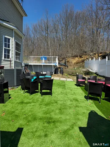 a view of a chairs and tables in the patio