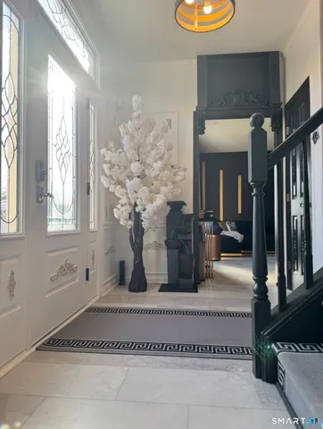 a bathroom with a granite countertop sink a toilet and mirror