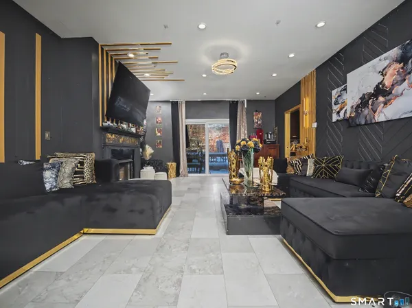 a living room with furniture and a fireplace