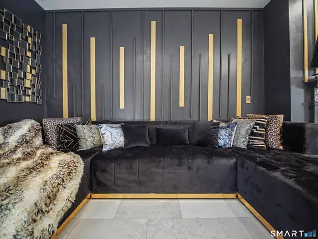 a living room with a bed