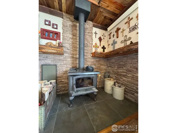 a open kitchen with stainless steel appliances kitchen island granite countertop a sink table and chairs