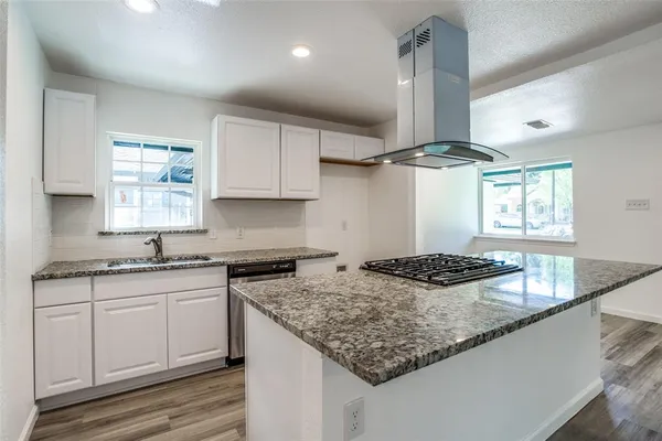 a view of a kitchen with a sink and a kitchen view