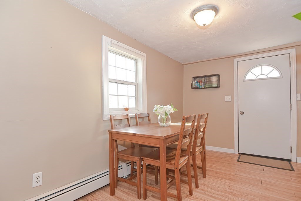 9 Bridge Street Grafton, MA 01536 - Photo 12 of 34 a view of a dining room with furniture and wooden floor