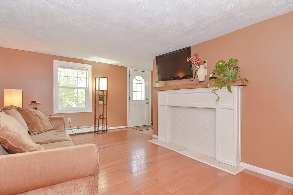 9 Bridge Street Grafton, MA 01536 - Photo 15 of 34 a living room with furniture and a flat screen tv