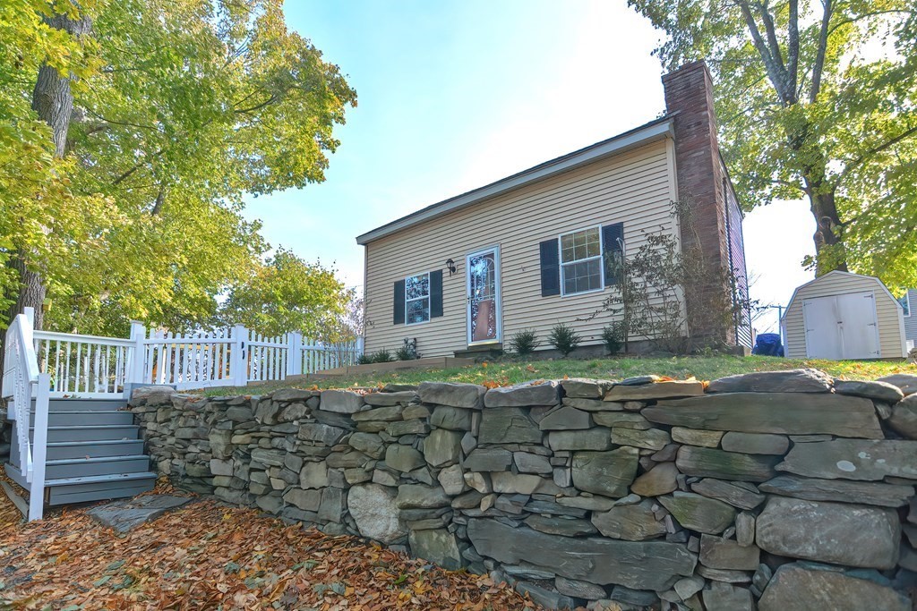 9 Bridge Street Grafton, MA 01536 - Photo 2 of 34 a front view of a house with a yard
