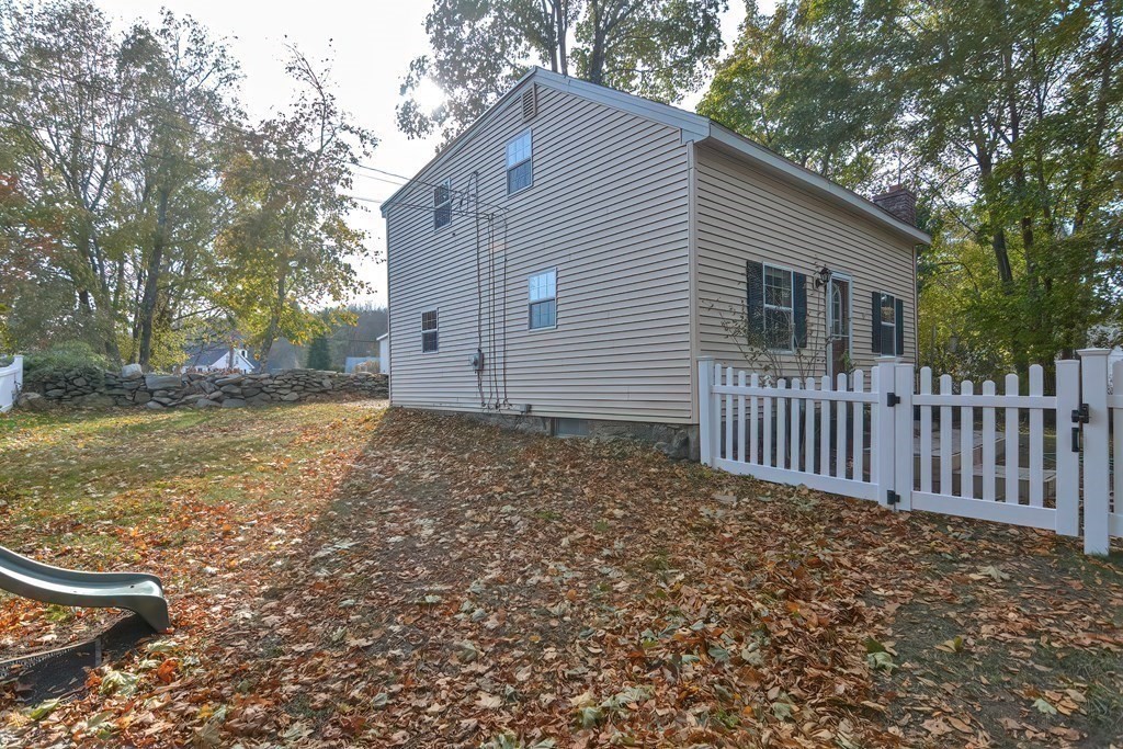 9 Bridge Street Grafton, MA 01536 - Photo 26 of 34 a view of a house with a yard and fence