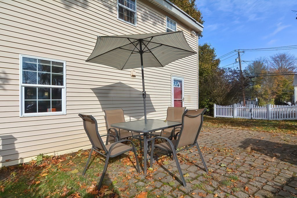 9 Bridge Street Grafton, MA 01536 - Photo 28 of 34 a view of a house with backyard and sitting area