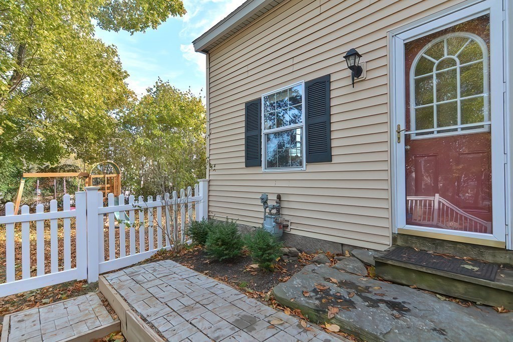 9 Bridge Street Grafton, MA 01536 - Photo 3 of 34 a front view of a house with a garden
