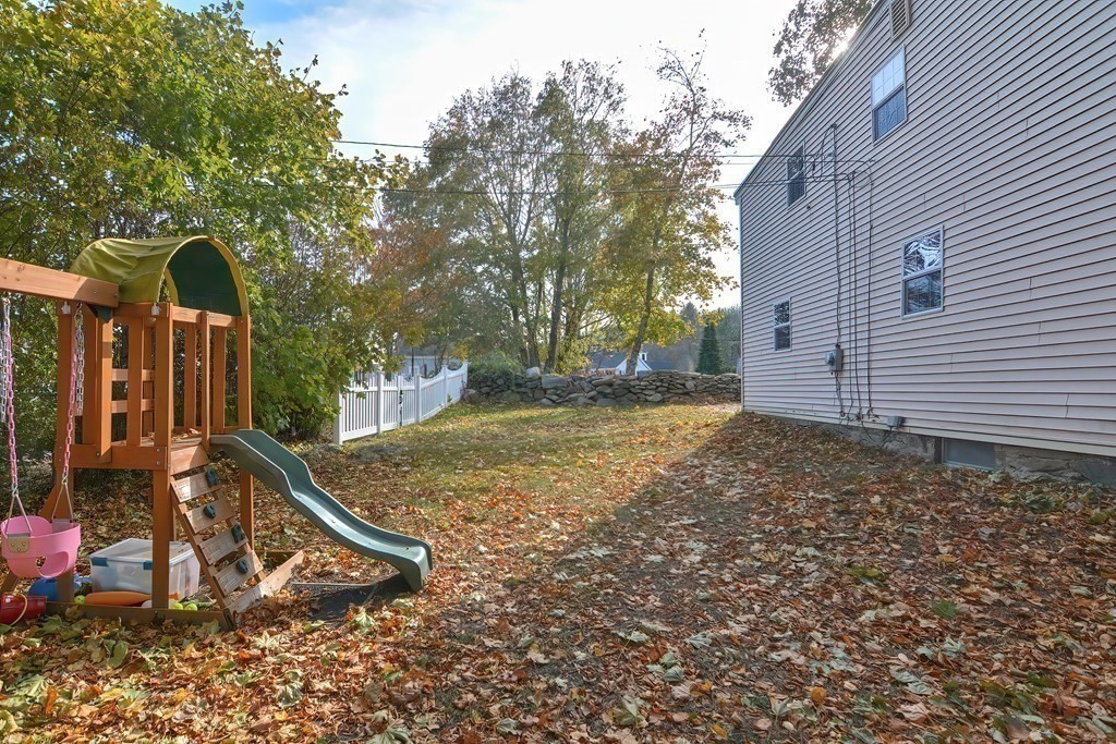 9 Bridge Street Grafton, MA 01536 - Photo 32 of 34 a view of a backyard with a tree