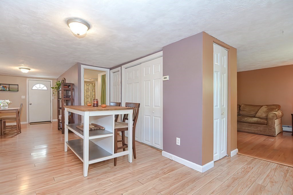9 Bridge Street Grafton, MA 01536 - Photo 8 of 34 a view of a livingroom with furniture and wooden floor