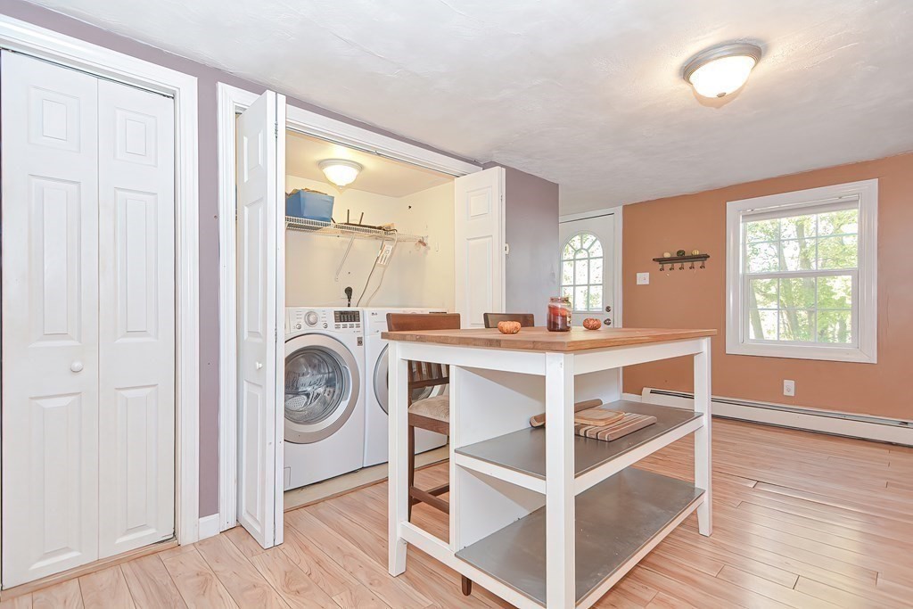 9 Bridge Street Grafton, MA 01536 - Photo 10 of 34 a view of a kitchen from the dinning room and windows