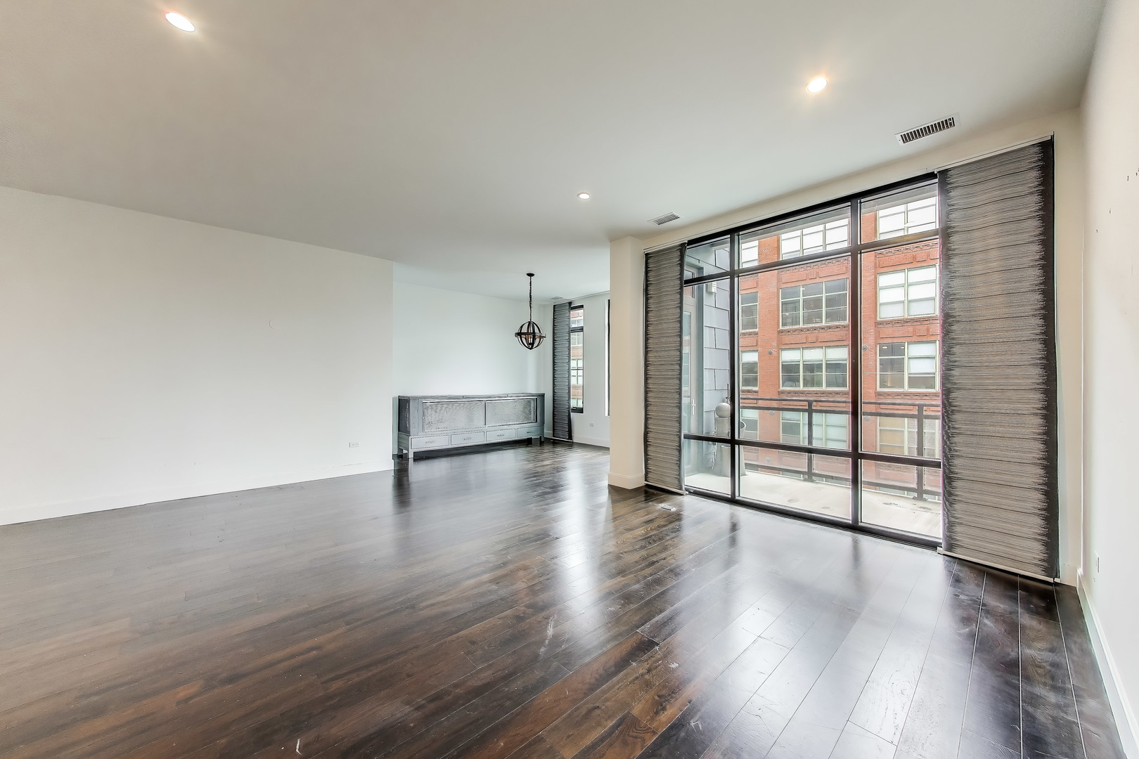36 North Carpenter Street, Unit 4S Chicago, IL 60607 - Photo 13 of 32 wooden floor in an empty room with a window