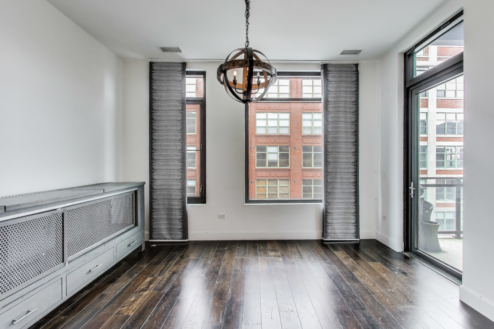 36 North Carpenter Street, Unit 4S Chicago, IL 60607 - Photo 15 of 32 a view of an entryway with wooden floor and windows