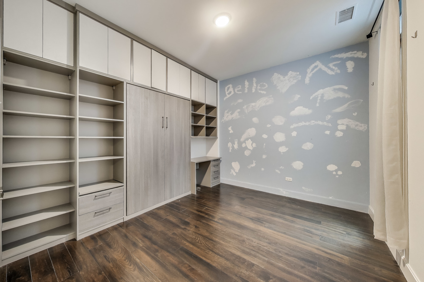 36 North Carpenter Street, Unit 4S Chicago, IL 60607 - Photo 19 of 32 a view of an empty room with a window and wooden floor