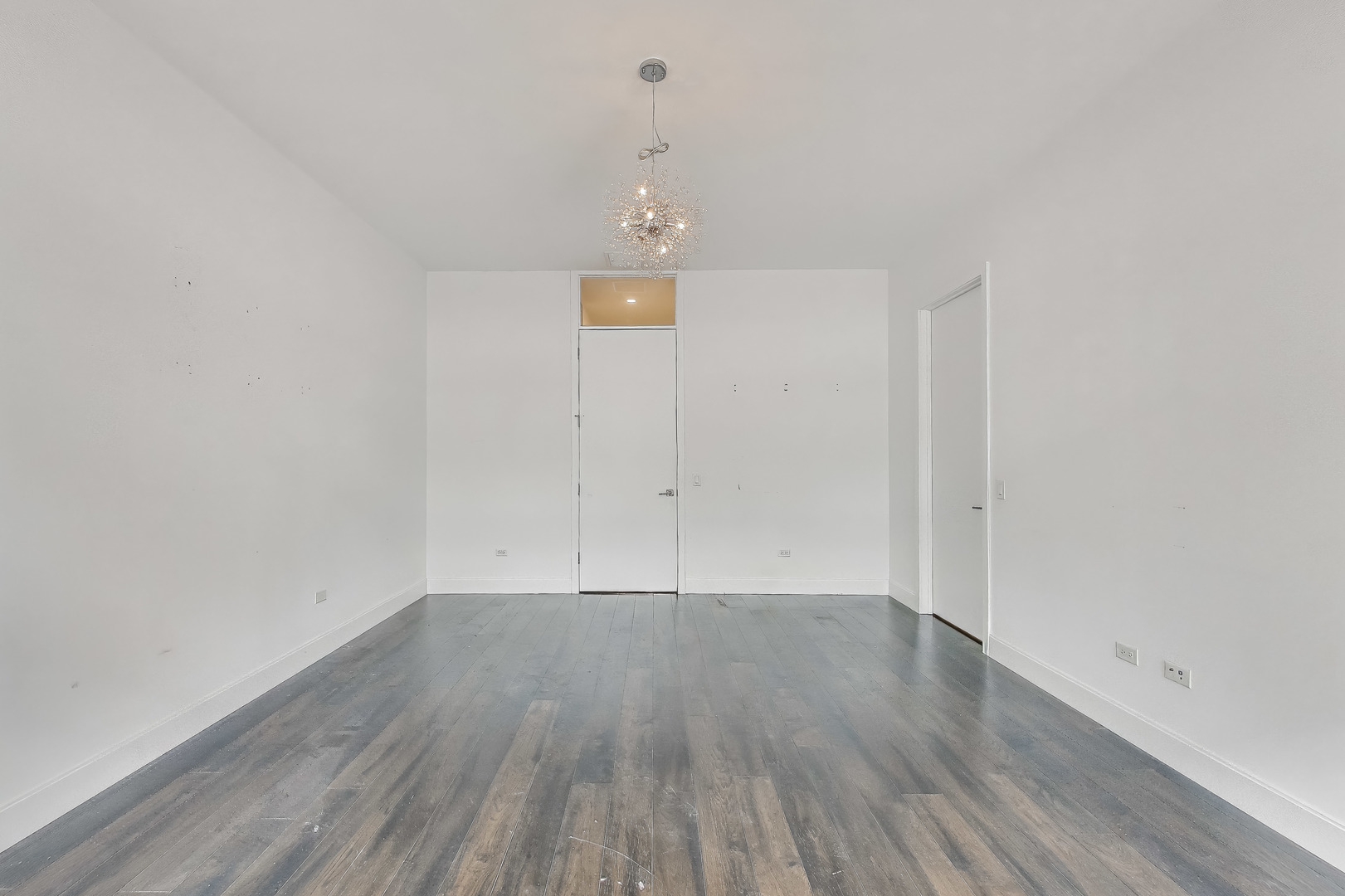 36 North Carpenter Street, Unit 4S Chicago, IL 60607 - Photo 20 of 32 wooden floor in an empty room