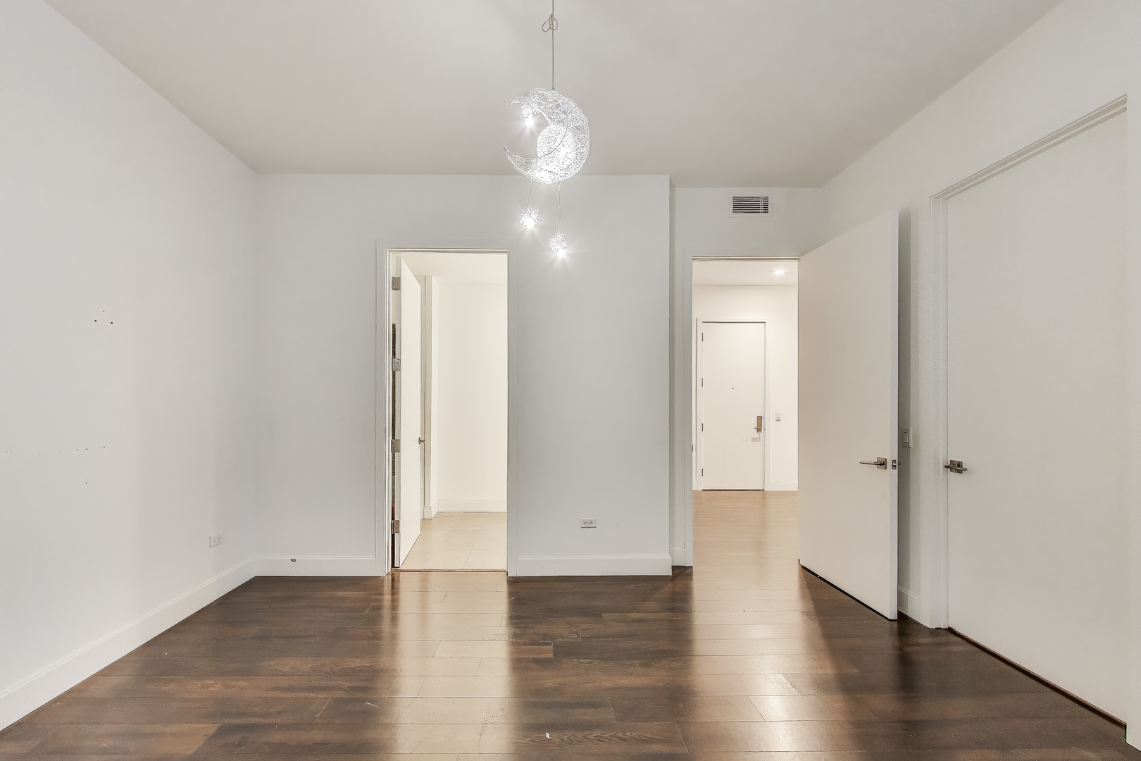 36 North Carpenter Street, Unit 4S Chicago, IL 60607 - Photo 21 of 32 an empty room with wooden floor and windows