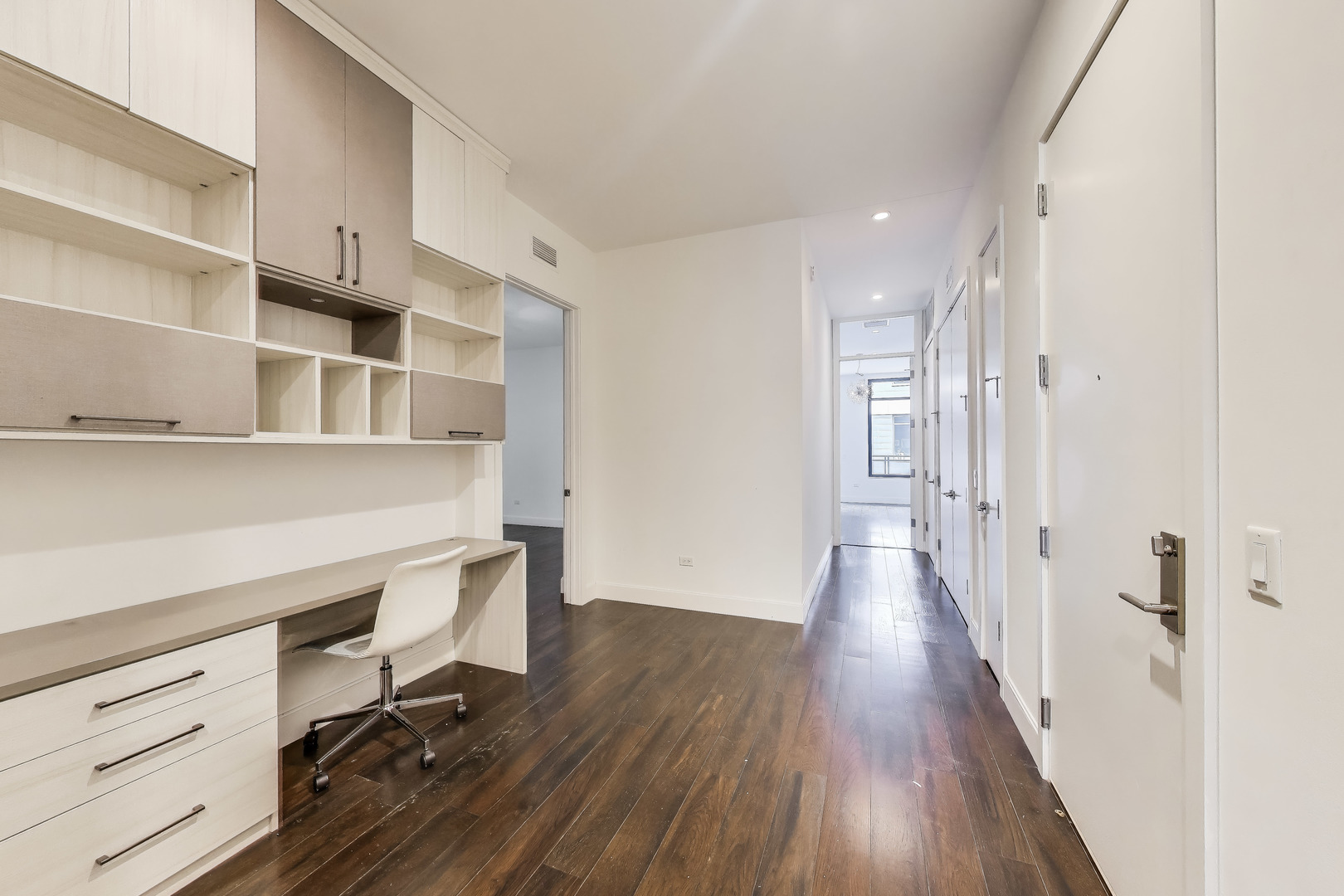 36 North Carpenter Street, Unit 4S Chicago, IL 60607 - Photo 24 of 32 a view of a hallway with wooden floor and cabinets