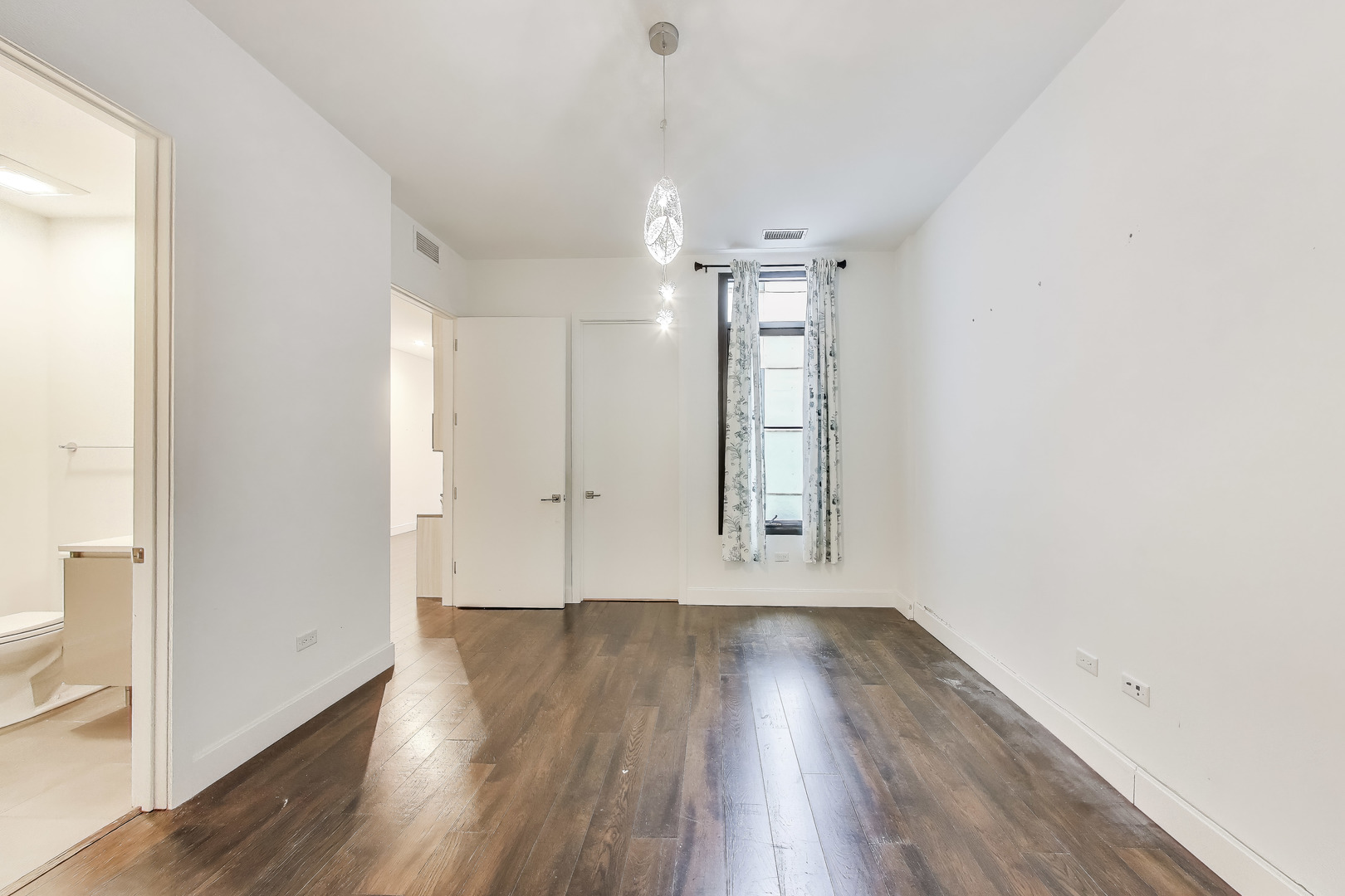 36 North Carpenter Street, Unit 4S Chicago, IL 60607 - Photo 26 of 32 wooden floor in an empty room with a window