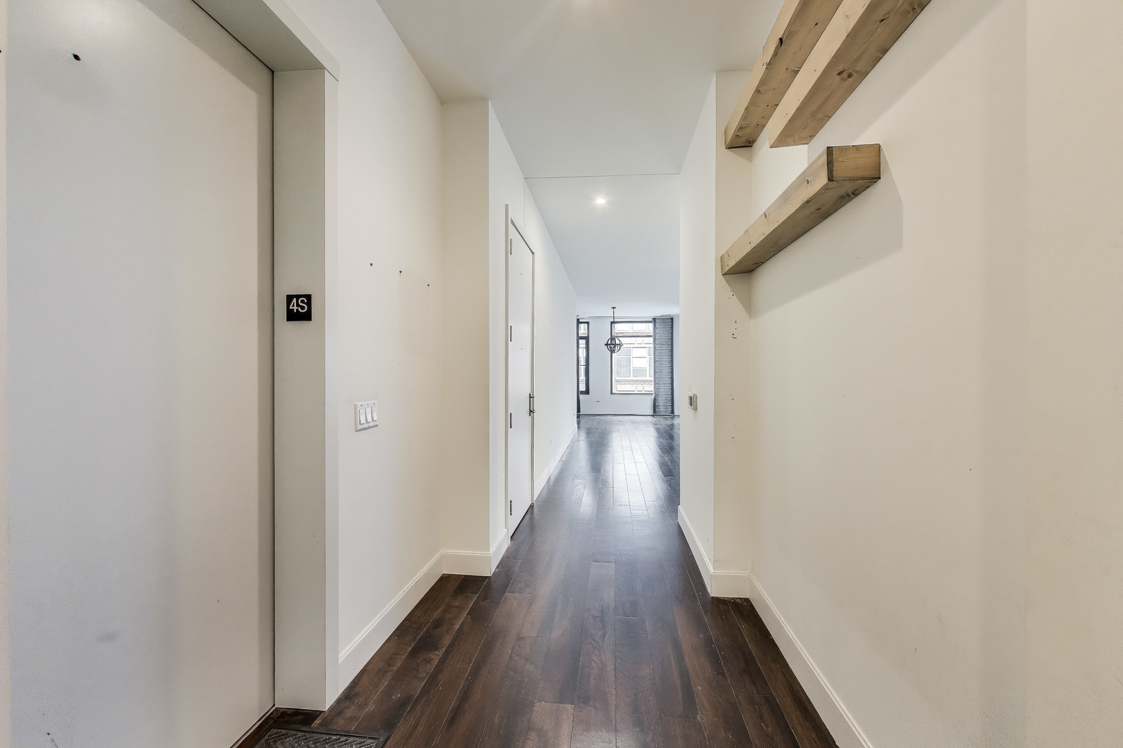 36 North Carpenter Street, Unit 4S Chicago, IL 60607 - Photo 6 of 32 a view of a hallway with wooden floor