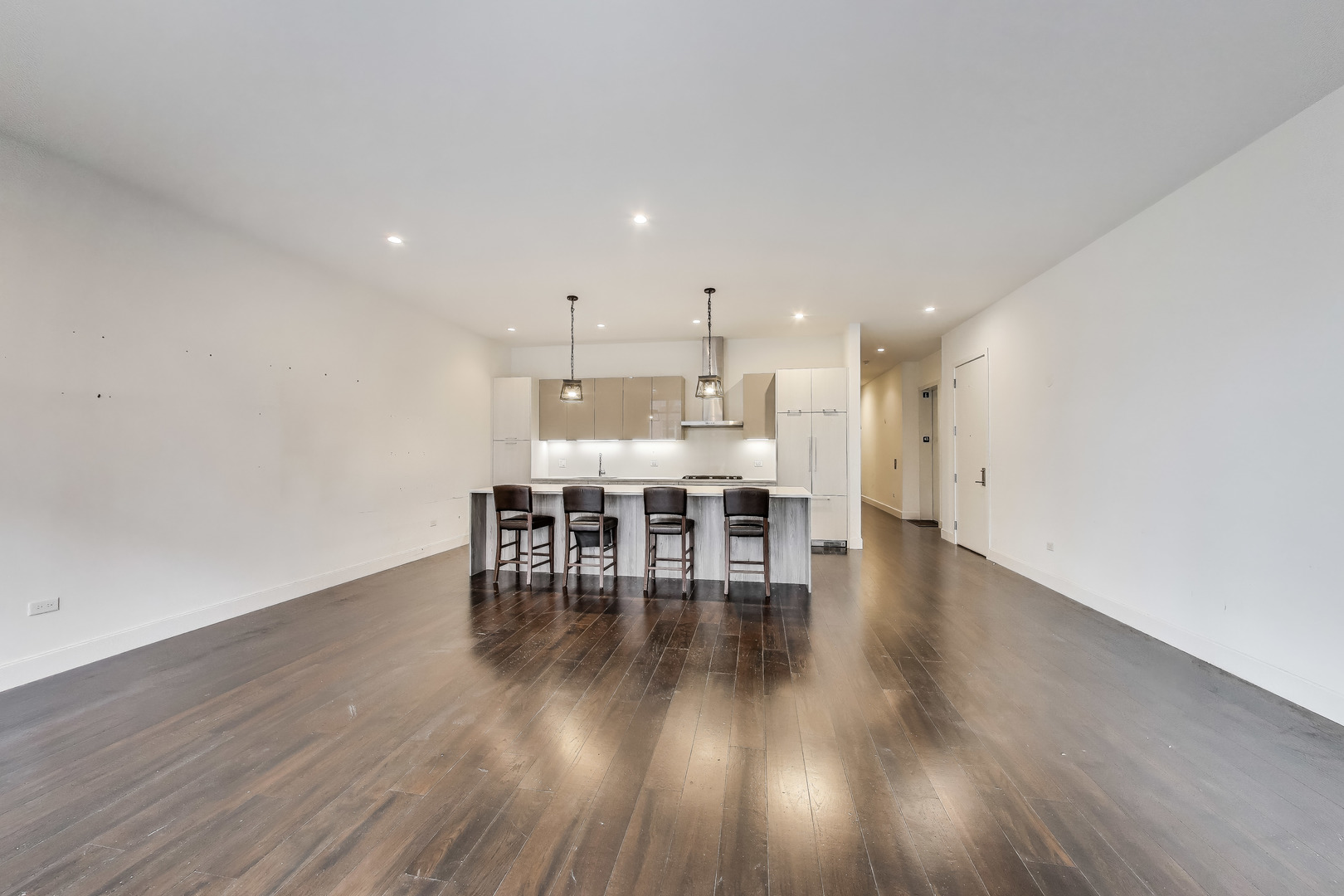 36 North Carpenter Street, Unit 4S Chicago, IL 60607 - Photo 8 of 32 a view of a kitchen with dining table chairs and wooden floor