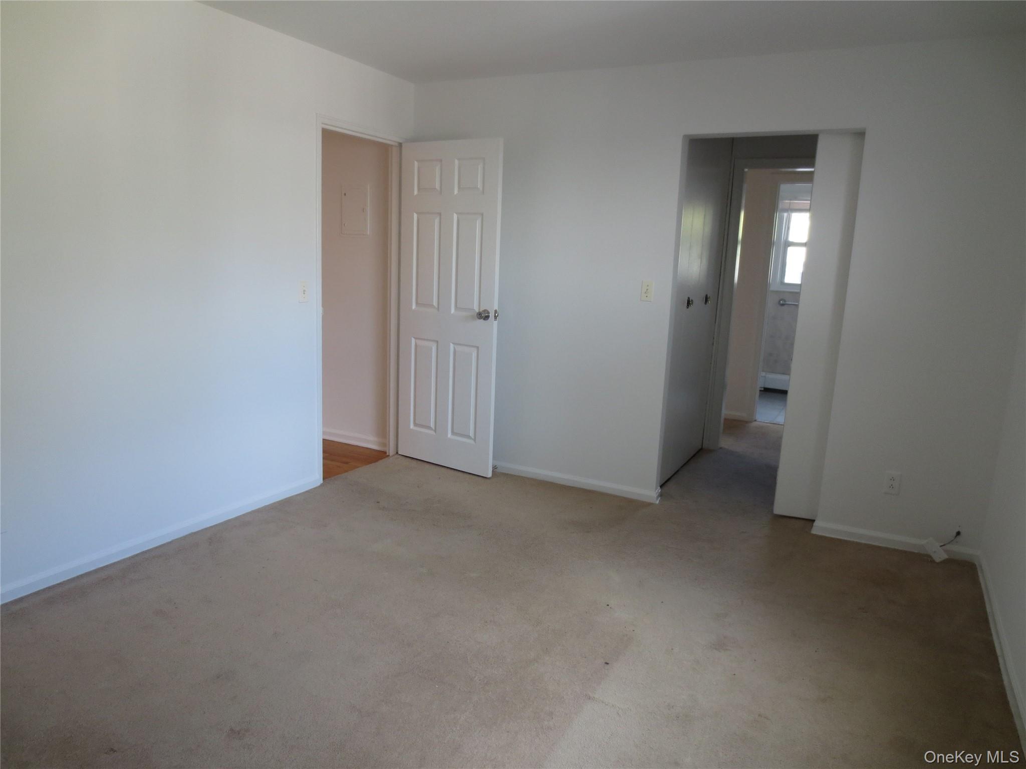 4 Oxford Court, Unit 8007 Suffern, NY 10901 - Photo 13 of 13 Unfurnished bedroom with light colored carpet