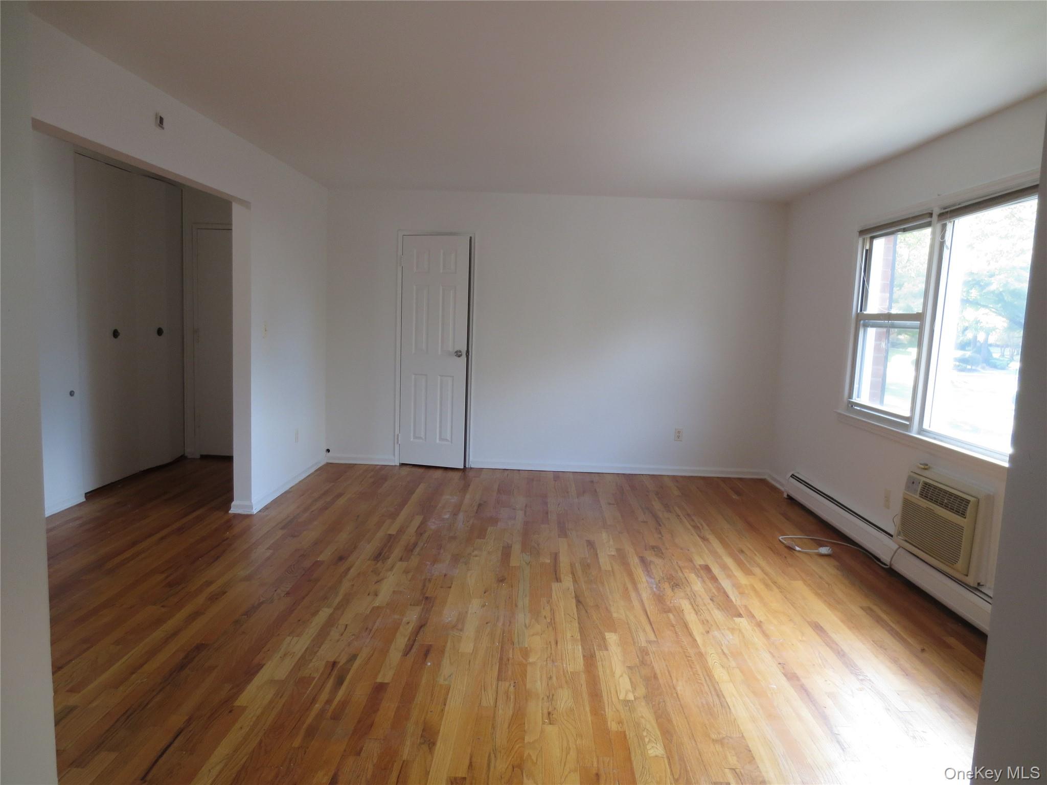4 Oxford Court, Unit 8007 Suffern, NY 10901 - Photo 8 of 13 Living room featuring light wood flooring