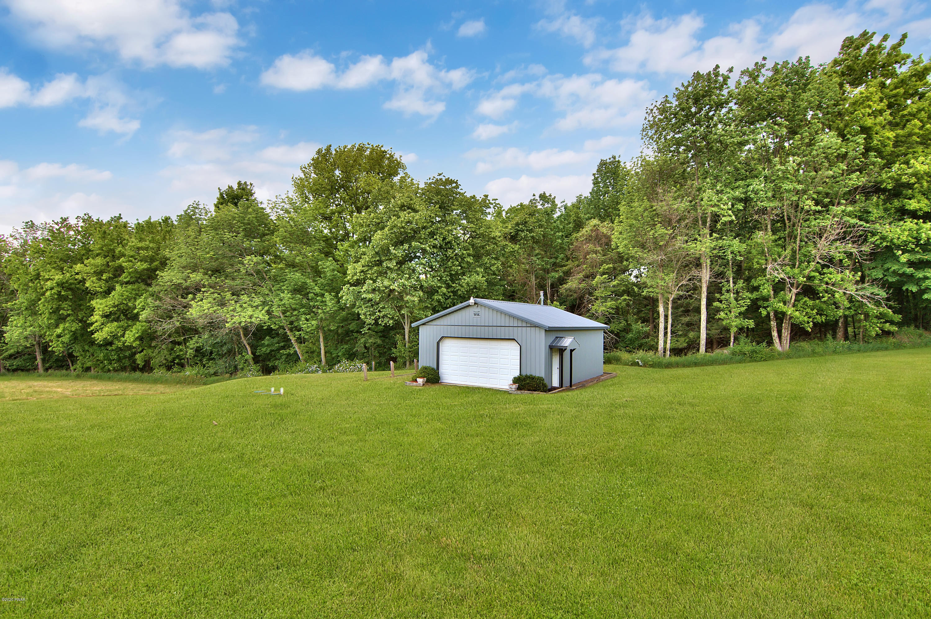 63 Callapoose Road Moscow, PA 18444 - Photo 8 of 73 a view of a trees with a big yard