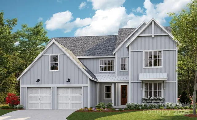 a view of house with yard and green space