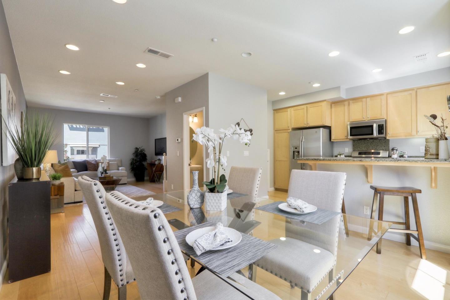 543 Saco Terrace Sunnyvale, CA 94089 - Photo 11 of 50 a living room with stainless steel appliances furniture a dining table and chairs