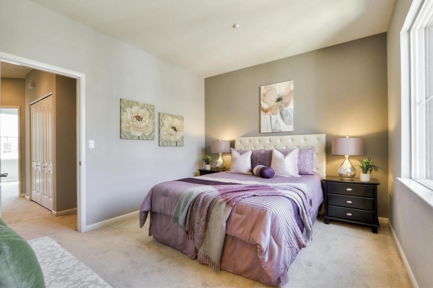 543 Saco Terrace Sunnyvale, CA 94089 - Photo 18 of 50 a spacious bedroom with a bed and a lamp