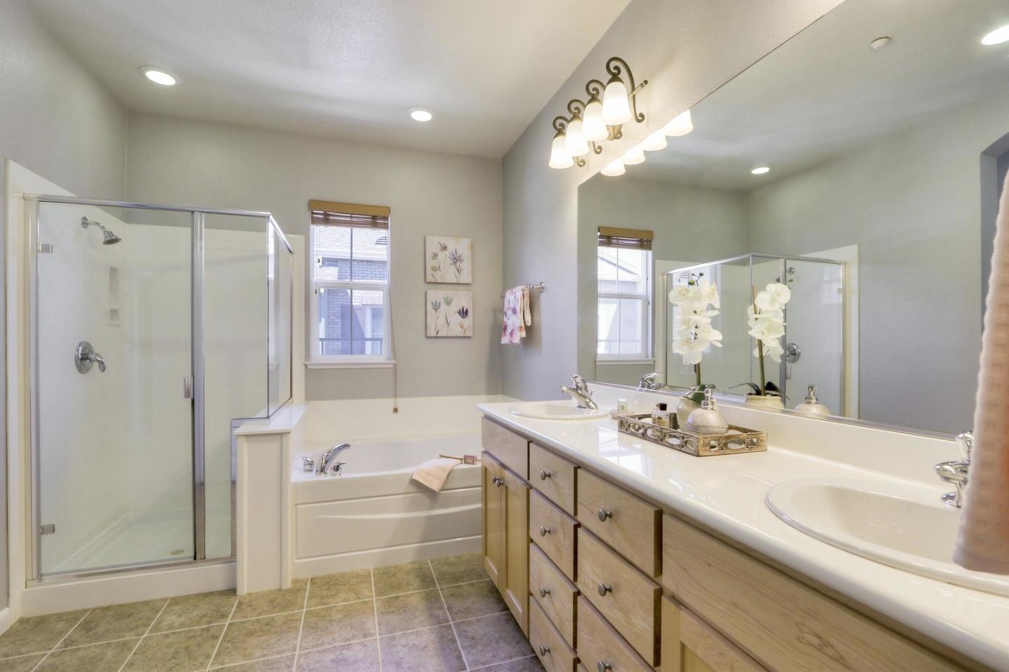 543 Saco Terrace Sunnyvale, CA 94089 - Photo 22 of 50 a bathroom with a double vanity sink mirror and shower