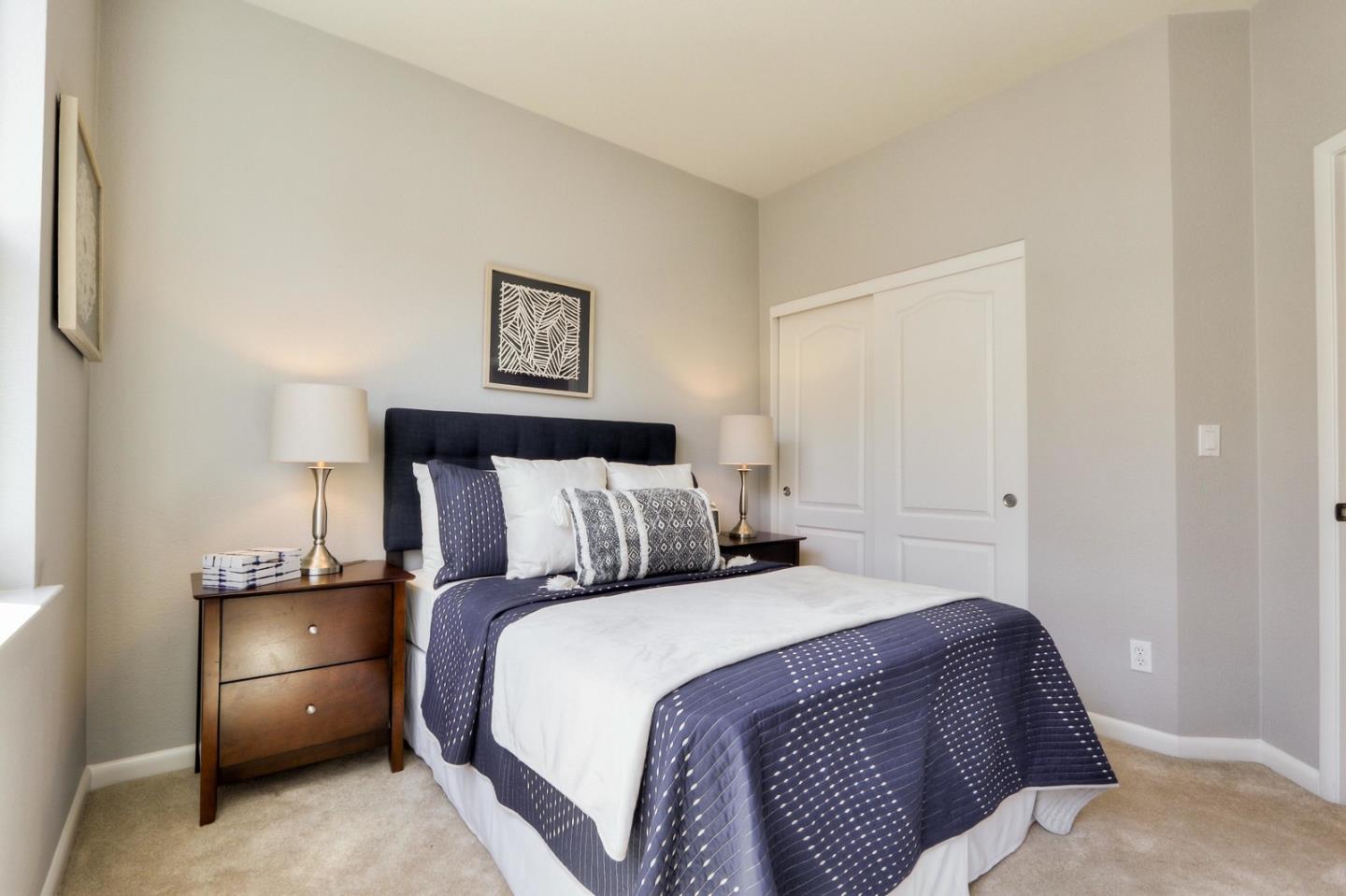 543 Saco Terrace Sunnyvale, CA 94089 - Photo 30 of 50 a bedroom with a bed and a lamp