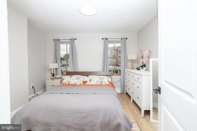 a bedroom with a bed and window