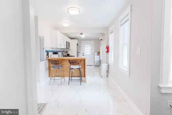 a view of a kitchen with dining table and chairs