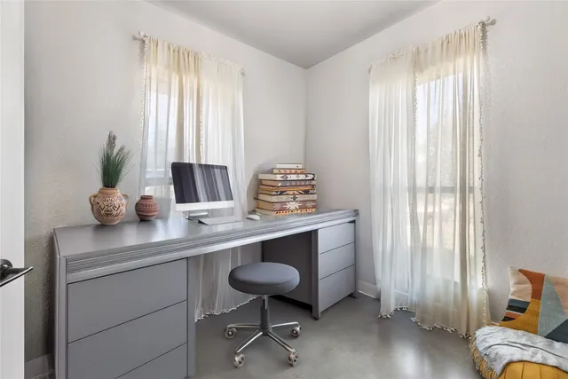a view of room with window and furniture