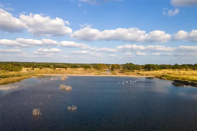 an aerial view of residential building and ocean
