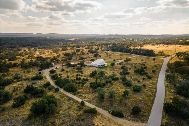 an aerial view of residential building and trees
