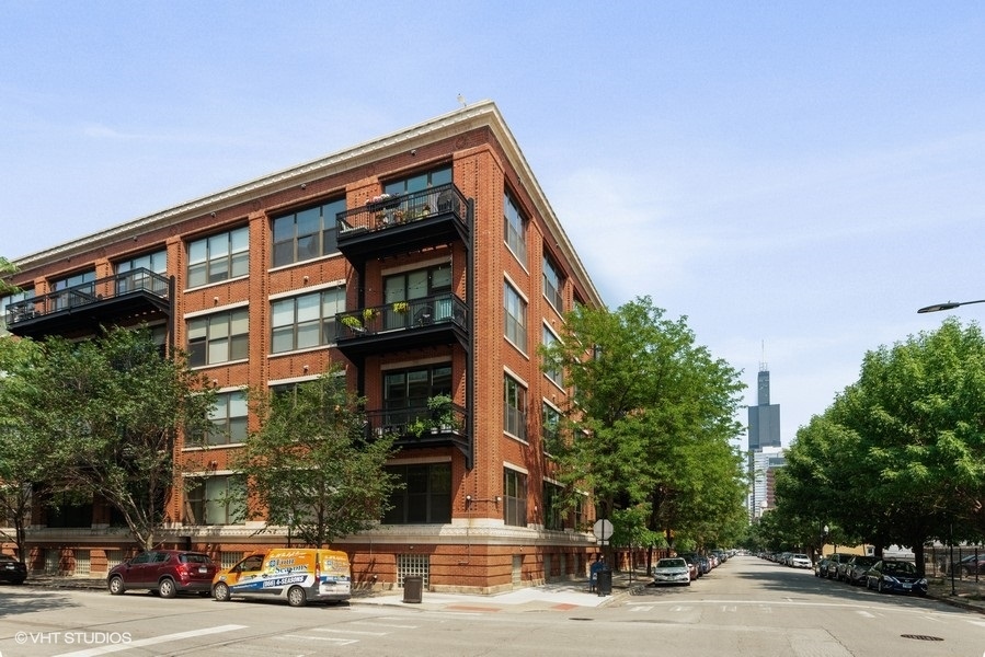 1040 West Adams Street, Unit 336 Chicago, IL 60607 - Photo 1 of 23 a front view of a building and a street view