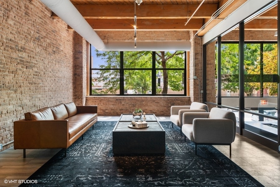 1040 West Adams Street, Unit 336 Chicago, IL 60607 - Photo 2 of 23 a living room with furniture and a large window