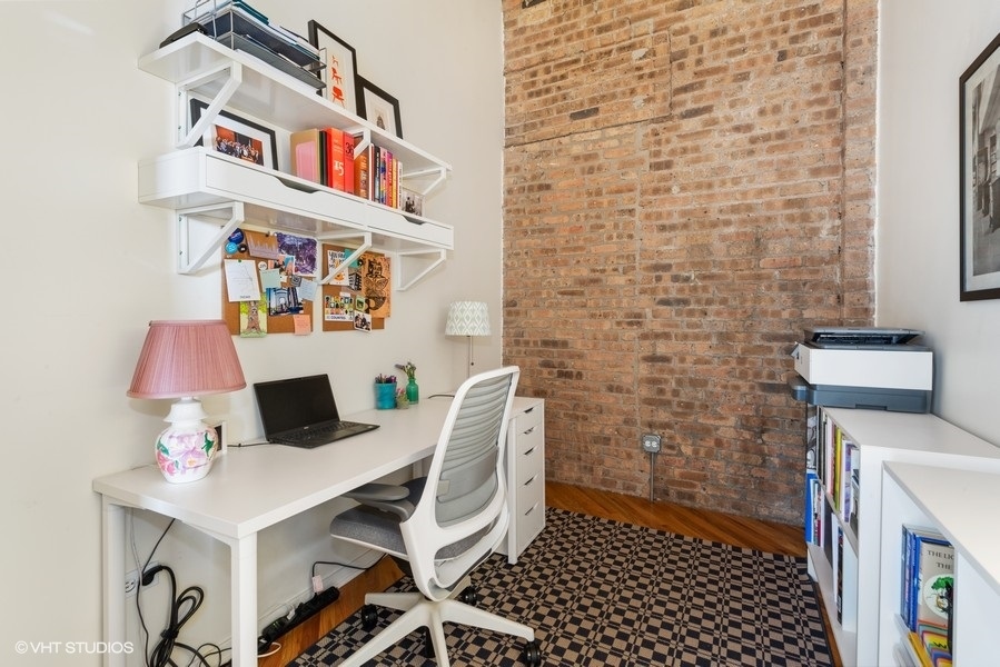 1040 West Adams Street, Unit 336 Chicago, IL 60607 - Photo 11 of 23 a work place with a desk and chair