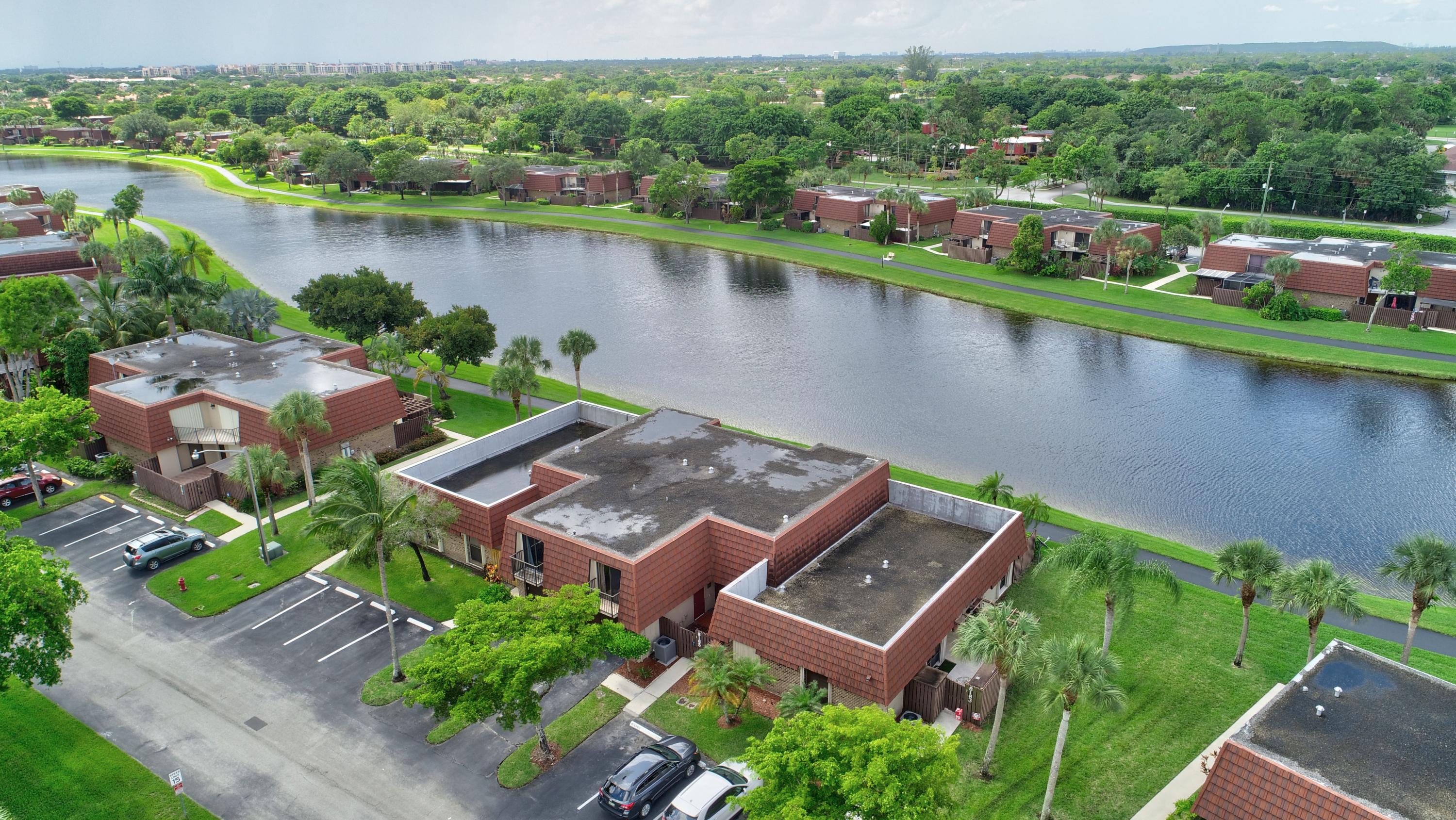 8165 Boca Rio Drive Boca Raton, FL 33433 - Photo 41 of 49 an aerial view of a house with a lake view