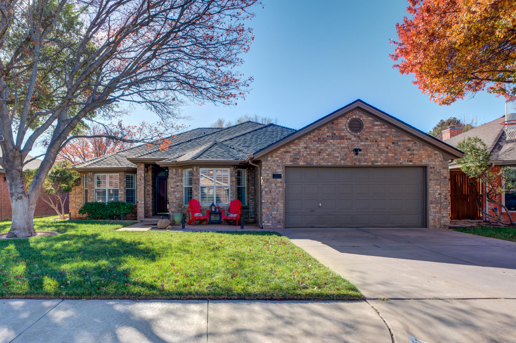 5407 68th Street Lubbock, TX 79424 - Photo 1 of 40 a front view of a house with a yard and garage