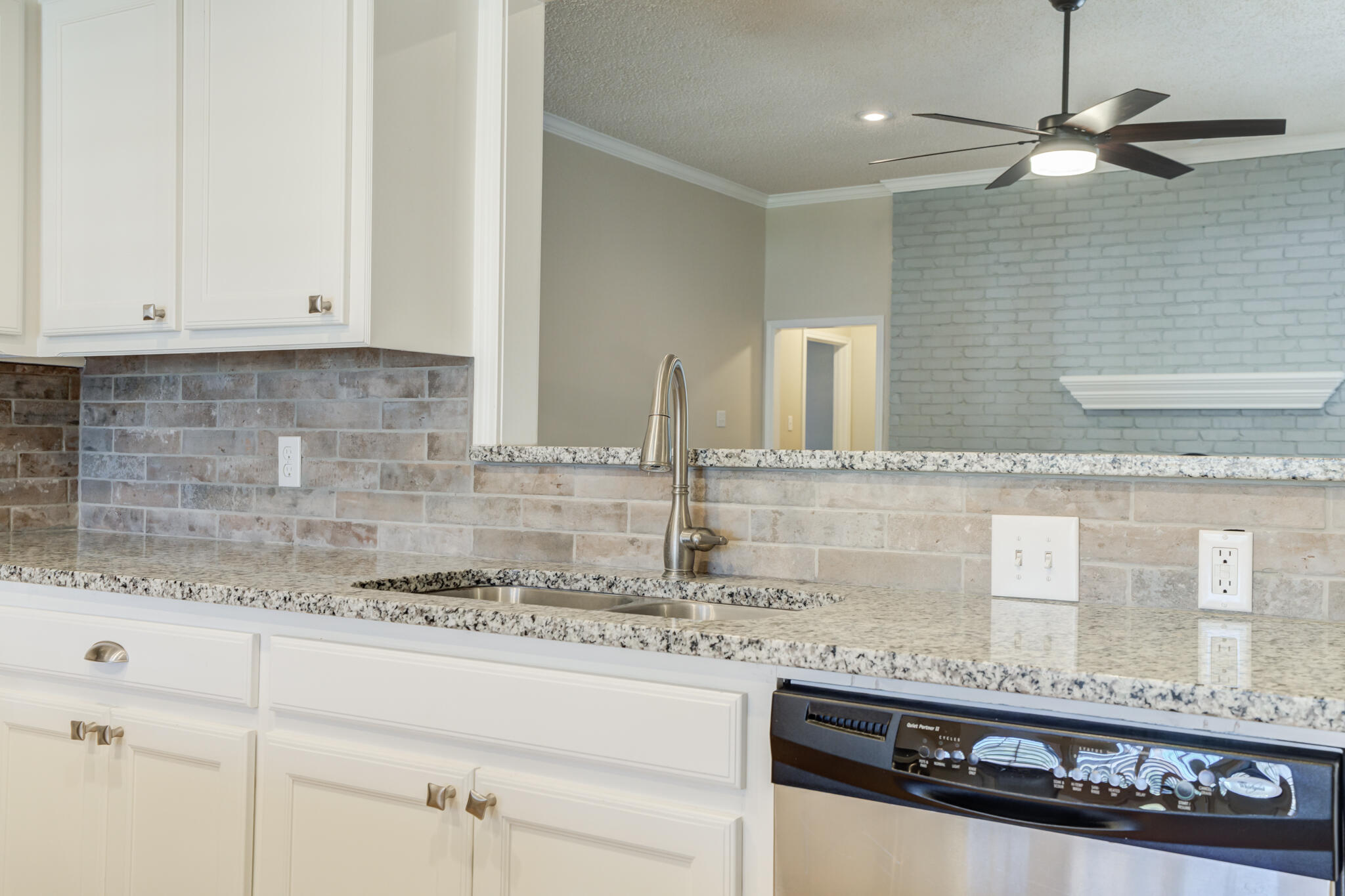 5407 68th Street Lubbock, TX 79424 - Photo 14 of 40 a kitchen with granite countertop stainless steel appliances sink and cabinets