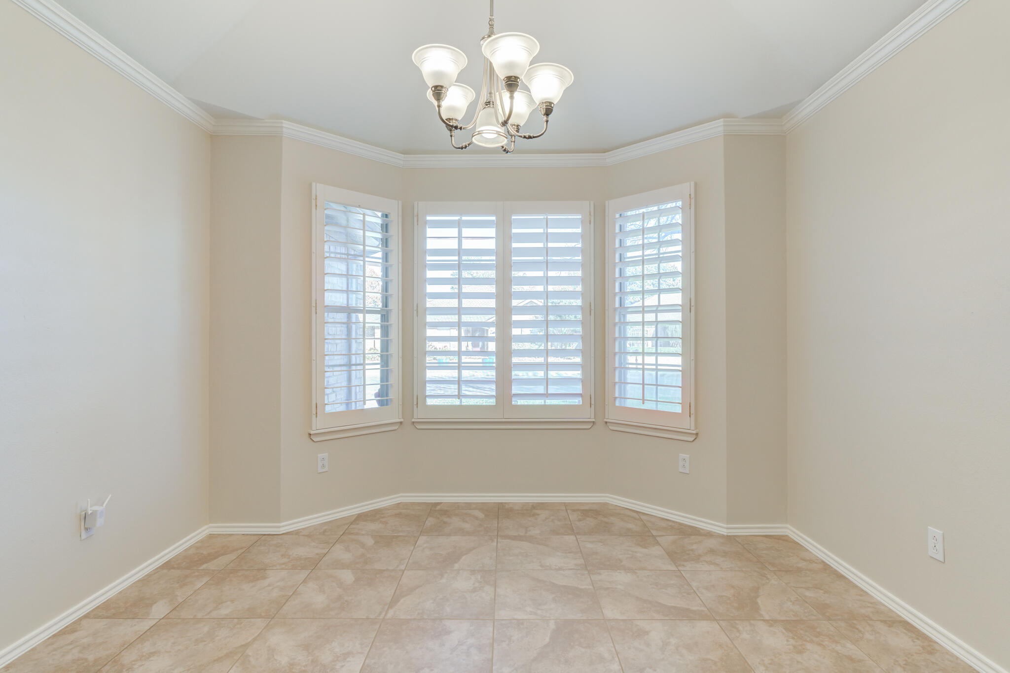 5407 68th Street Lubbock, TX 79424 - Photo 17 of 40 a view of an empty room with a window