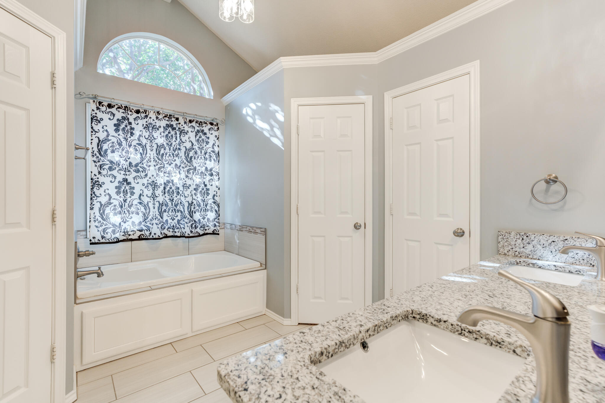 5407 68th Street Lubbock, TX 79424 - Photo 19 of 40 a bathroom with a tub sink and shower
