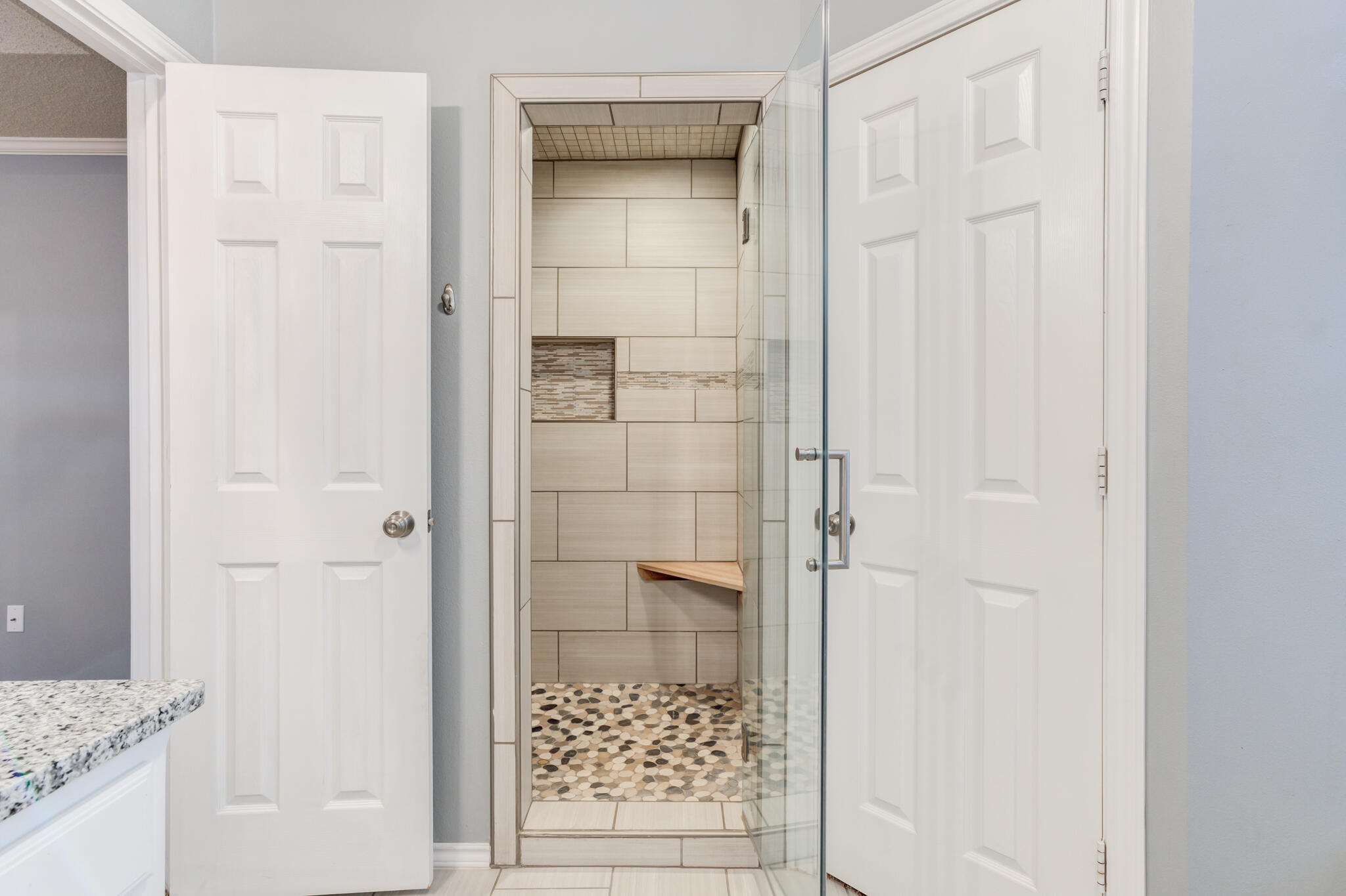 5407 68th Street Lubbock, TX 79424 - Photo 20 of 40 view of a bathroom with a shower and a sink